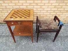 A chessboard table measuring approximately 72 cm x 51 cm x 51 cm and a piano stool.