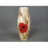 Moorcroft Pottery - a tall vase decorated in the Harvest Poppy design,