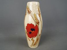 Moorcroft Pottery - a tall vase decorated in the Harvest Poppy design,