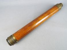 A brass and wood single draw telescope, marked 'Dollond London' to the barrel,