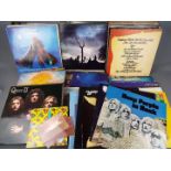 A box of 12" vinyl records to include Deep Purple, Queen, Whitesnake, Rolling Stones, ZZ Top,