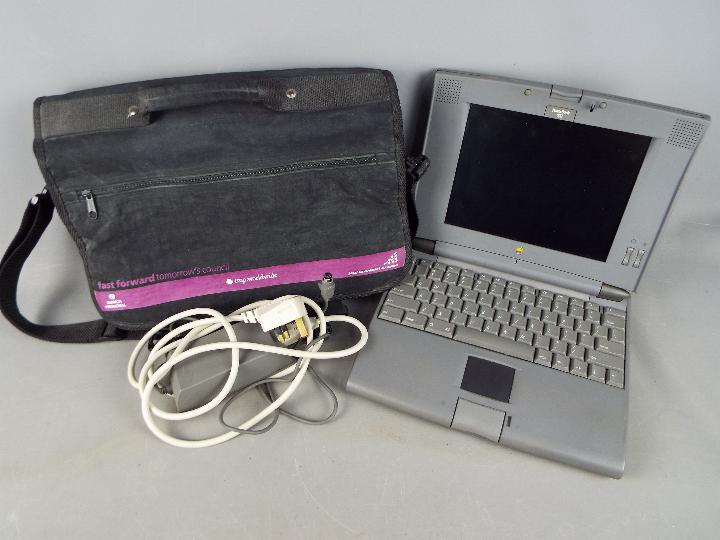 An Apple PowerBook 500 Series, model M4880, with carry bag and power adapter.