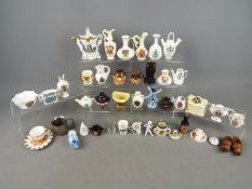 Lot to include various crested ware items, miniature Royal Doulton stoneware teapot and cream jug,