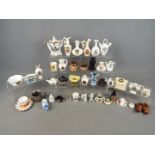 Lot to include various crested ware items, miniature Royal Doulton stoneware teapot and cream jug,