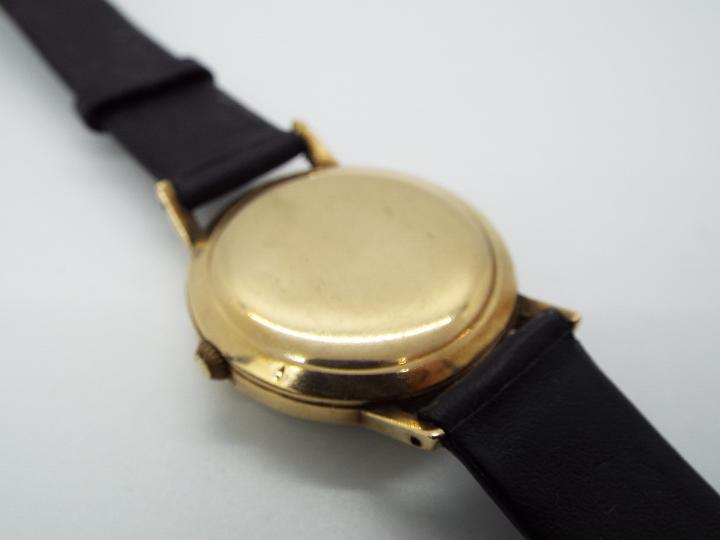 A gentleman's, yellow metal, Smiths Imperial wristwatch with black dial and 19 jewel movement, - Image 2 of 5