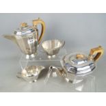 A George V silver four-piece Tea and Coffee set comprising teapot, coffee pot,