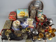 A quantity of metalware comprising plated, horse brasses, vintage tins and similar.