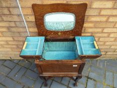 A Morco sewing box with hinged lid and fitted interior, approximately 65 cm x 47 cm x 37 cm.