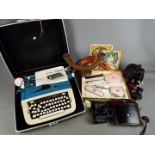 A vintage Imperial 'Safari' portable typewriter in case, cased pair of binoculars, treen,
