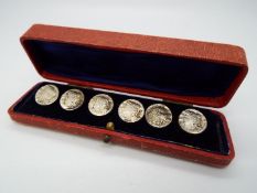 A set of six Edward VII hallmarked silver buttons, each depicting a lady in profile,