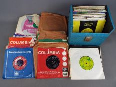 A collection of 7" vinyl records, 1 carry case and a bag, including John Lennon, Motown,