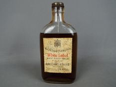 A half bottle of John Dewar & Sons Ltd 'White Label' Finest Scotch Whisky Of Great Age, spring cap,