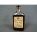 A half bottle of John Dewar & Sons Ltd 'White Label' Finest Scotch Whisky Of Great Age, spring cap,