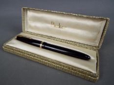 A vintage Parker Maxima Duofold fountain pen in black, with nib stamped 14k,