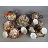 A collection of Oriental tea wares comprising a set of 24 pieces with polychrome decoration of