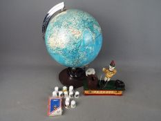 An illuminated globe, quantity of thimbles and cast iron money bank.