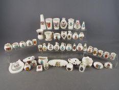 A collection of various Goss crested ware pieces, in excess of 45 pieces.