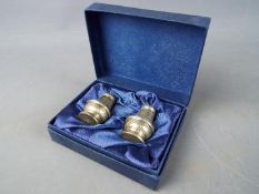A boxed set of hallmarked silver cruets, Birmingham assay.