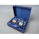 A boxed set of hallmarked silver cruets, Birmingham assay.