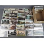 In excess of 400 UK topographical postcards to include real photos and street scenes,