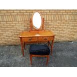 A dressing table and mirror, approximately 135 cm x 105 cm x 50 cm.