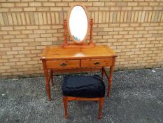 A dressing table and mirror, approximately 135 cm x 105 cm x 50 cm.