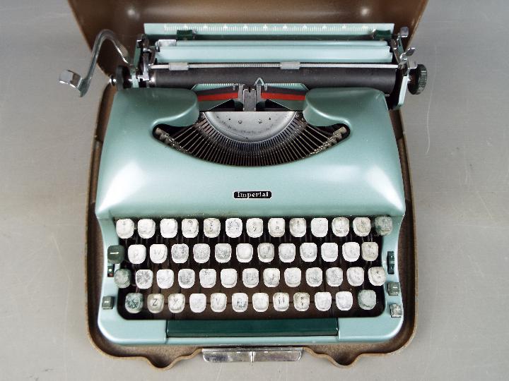 An Imperial 'Good Companion 5' portable typewriter in metal case.