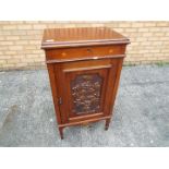 A side cupboard with inlaid and carved decoration, approximately 89 cm x 49 cm x 36.