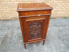 A side cupboard with inlaid and carved decoration, approximately 89 cm x 49 cm x 36.