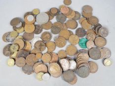 A quantity of UK coins including silver content examples.