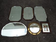 A quantity of wall mirrors of varying size.