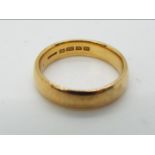 A hallmarked 22ct yellow gold wedding band, size L, approximately 5.5 grams all in.