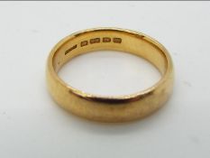 A hallmarked 22ct yellow gold wedding band, size L, approximately 5.5 grams all in.