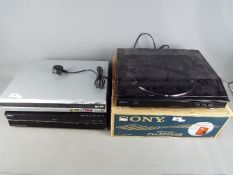 A boxed Sony PS-LX300USB turntable, a Sony DVD recorder and a further DVD recorder by Toshiba.