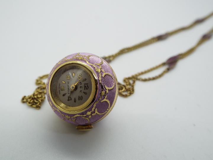 A Rex pendant globe watch, lilac toned body with gilt metal detailing, 17 jewel Swiss movement, - Image 2 of 3