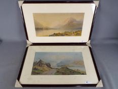 Two early colour prints depicting landscape scenes, each mounted and framed under glass,