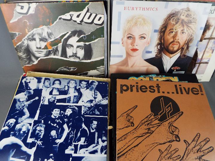 A collection of 12" vinyl records to include Judas Priest, Status Quo, Erasure, The Beach Boys, - Image 2 of 2