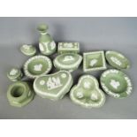 A collection of Wedgwood Jasperware pieces in green, twelve in total.