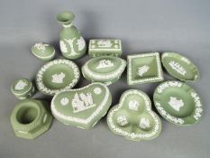 A collection of Wedgwood Jasperware pieces in green, twelve in total.