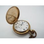 A yellow metal full hunter crown wind pocket watch,