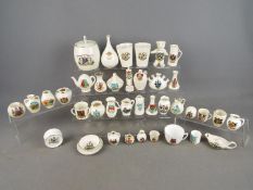 A collection of various crested ware pieces to include Arcadian, Carlton, Swan China and similar.