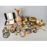 A collection of metalware, cased flatware and animal figurines.