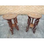 Two carved lamp tables or plant stands, each approximately 64 cm x 38 cm.