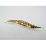 9ct gold - a 9ct gold bar brooch in the form of a leaf,