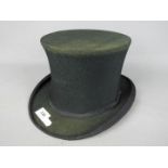 A Watson Prickard Ltd folding top hat, 15 cm (h), internal measurements approximately 7¾" by 6¼".