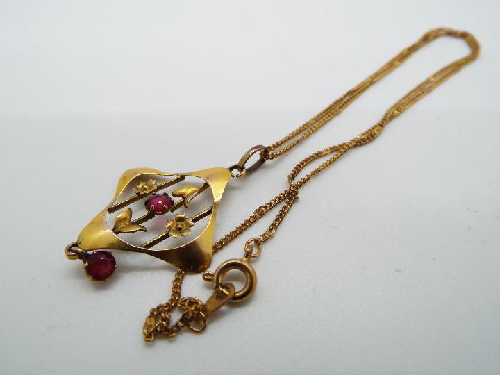 A yellow metal (unmarked) necklace with a 9ct gold pendant with stone set centre, - Image 3 of 4