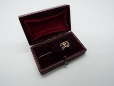 A vintage Rolls Royce lapel pin.