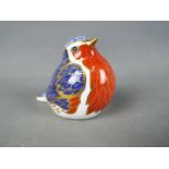 Royal Crown Derby - A paperweight in the form of a robin with gold stopper.