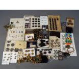 A collection of various buttons, buckles and similar.