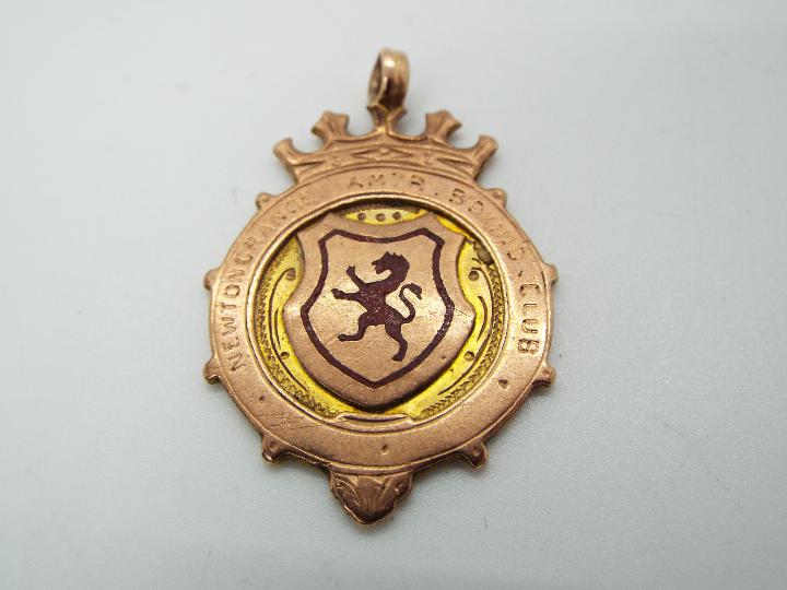 A 9ct gold Newtongrange Amateur Boxing Club medal, approximately 8.1 grams all in.